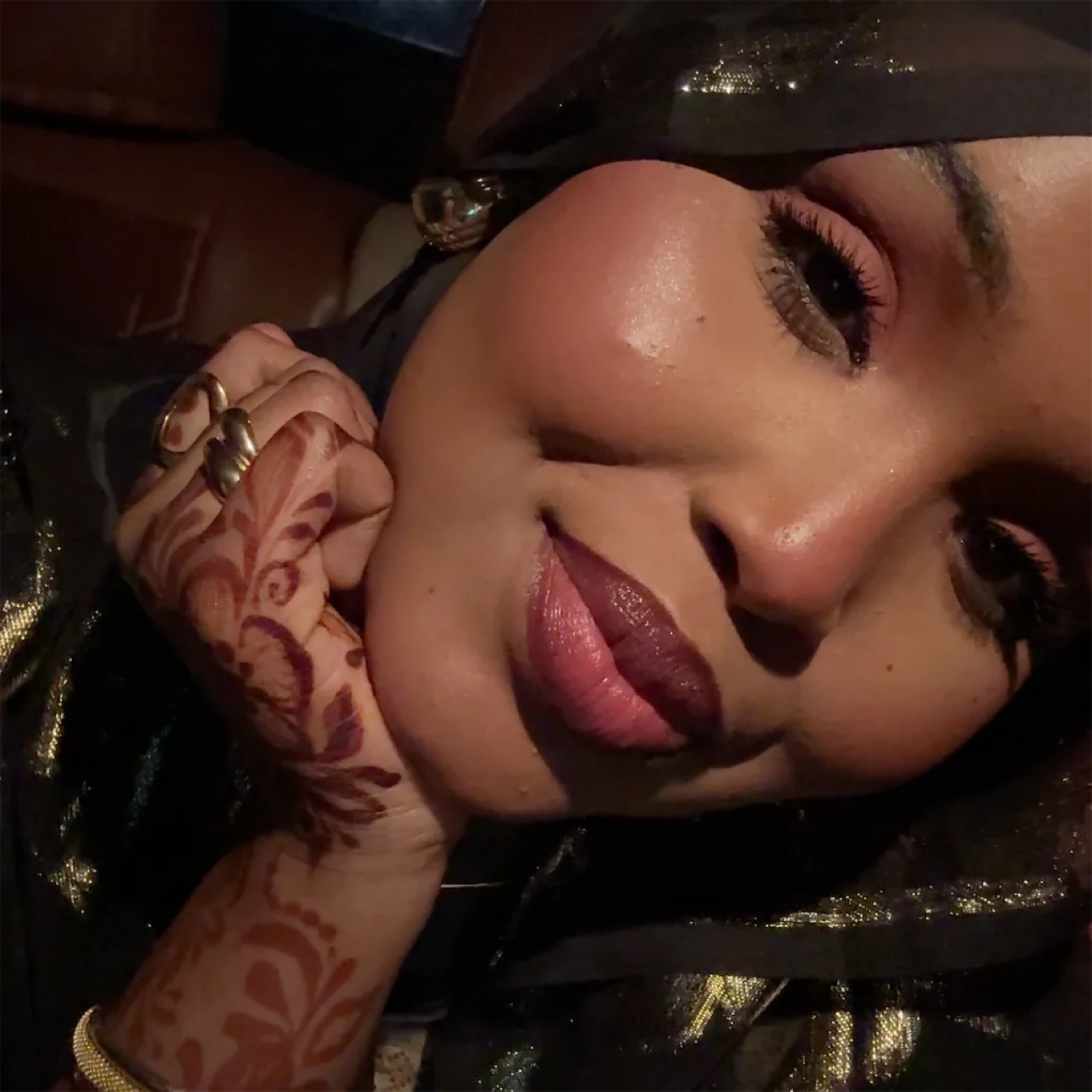 A close portrait of her with henna