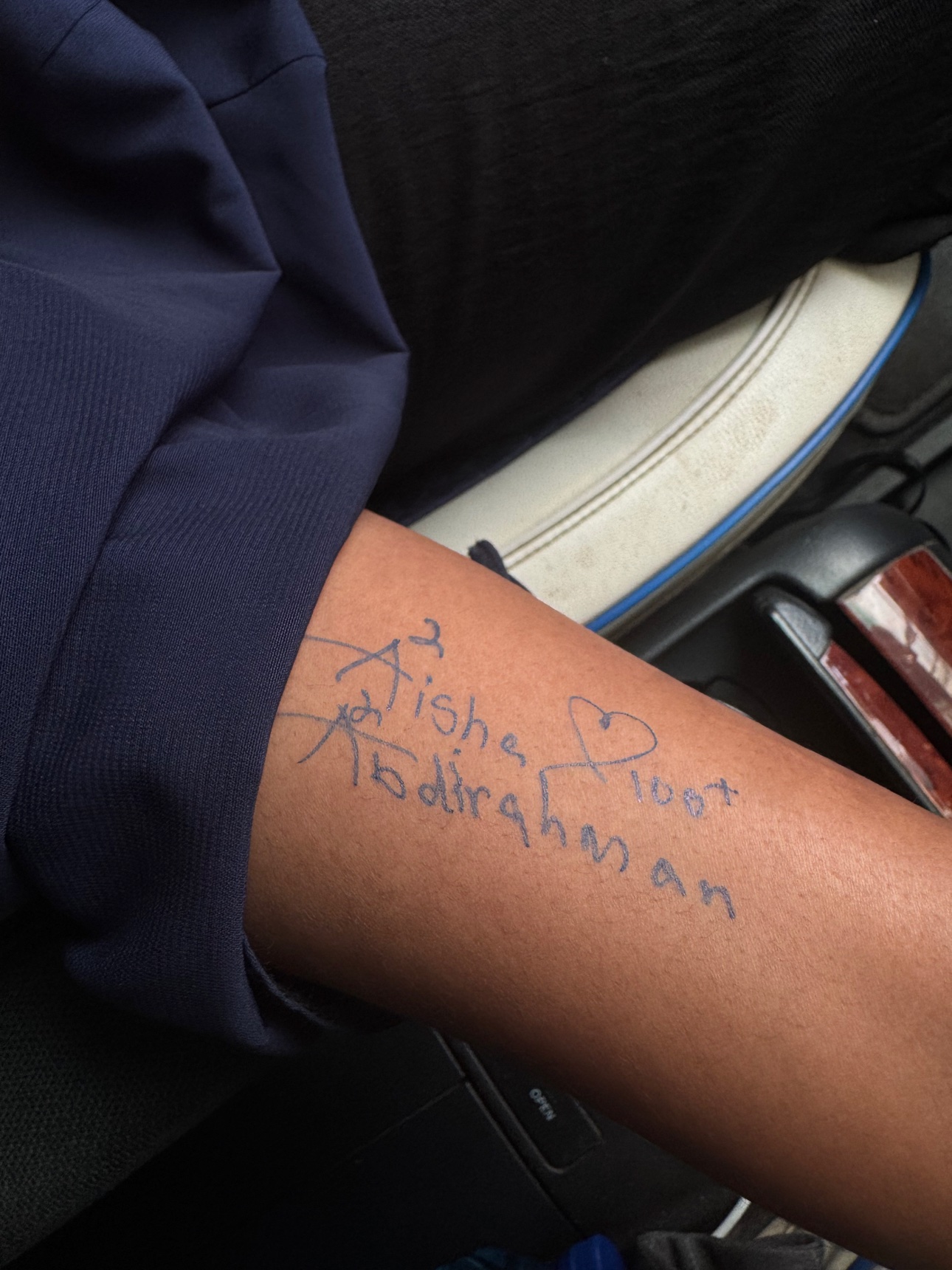 A handwritten note on an arm